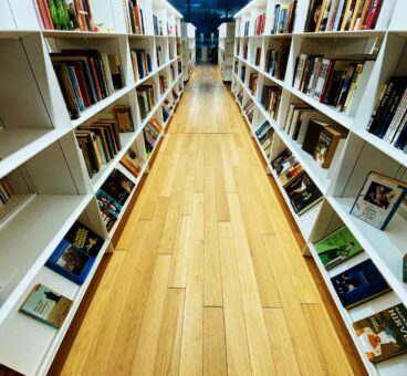 Library shelves with wooden floor